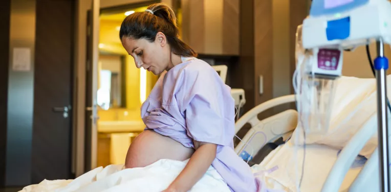 Person pregnant in hospital ward 