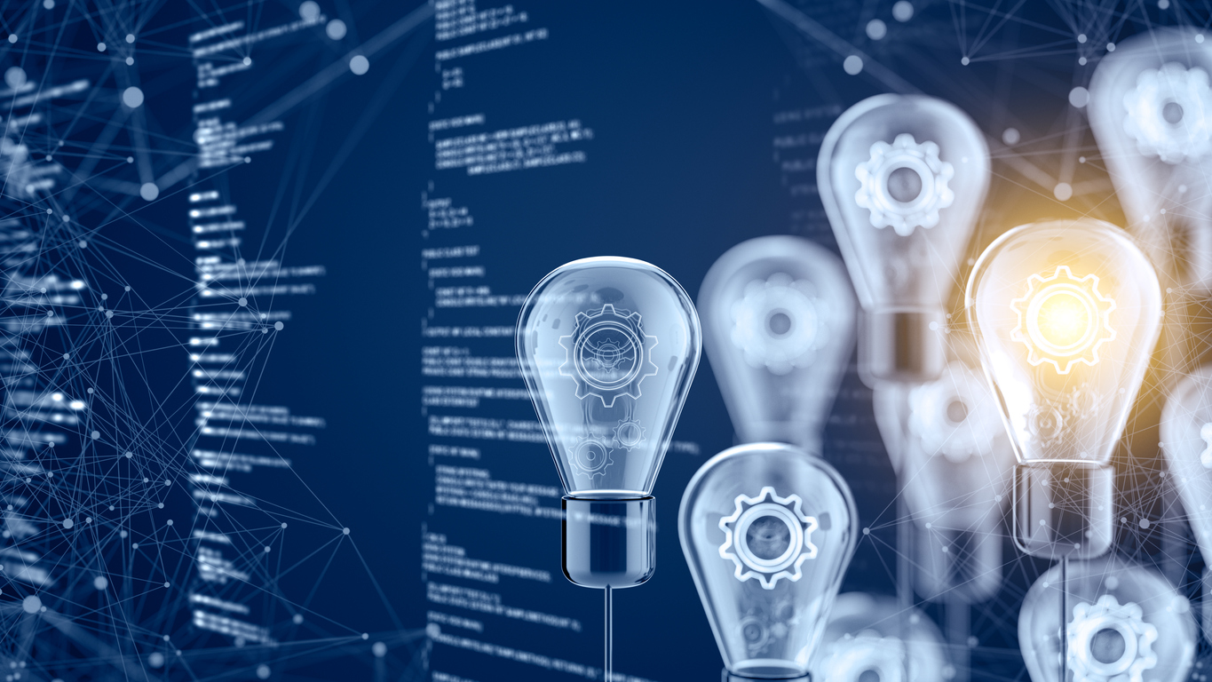 A group of lightbulbs on a blue background, one lightbulb is lit up