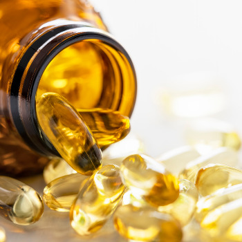 oil capsules spilling out of a bottle