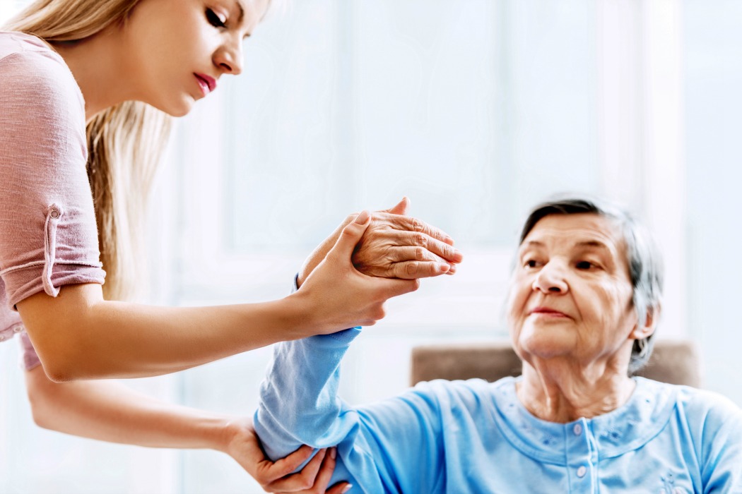 A physiotherapist manipulating a patients arm