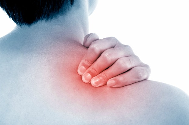 A man holding his neck, there is a red glow emanating from it