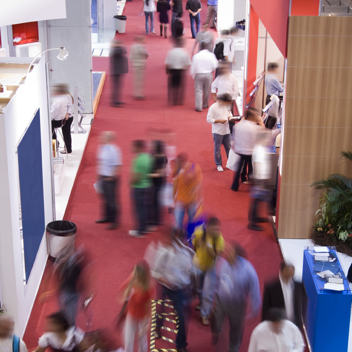 People moving around in a conference hall