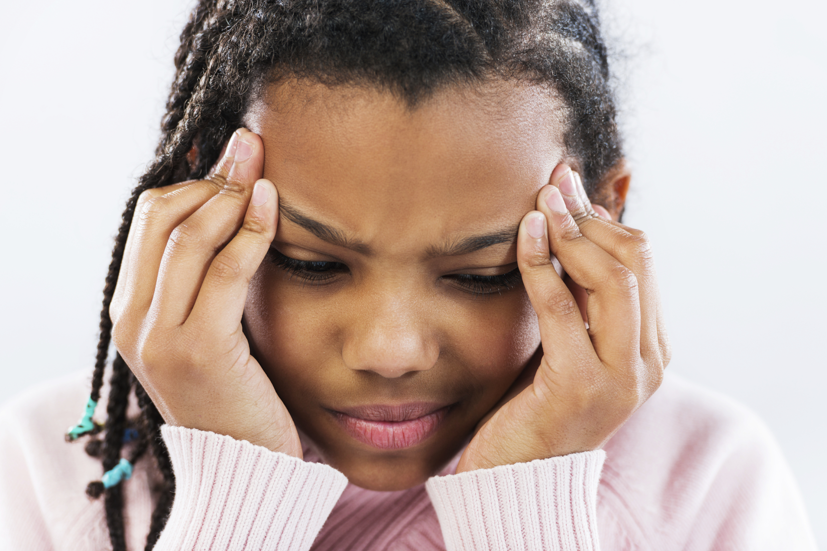 Girl clutching her temples